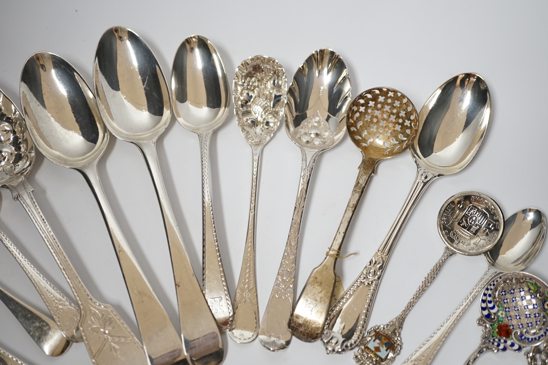 A quantity of assorted 19th century and later silver flatware, various dates and makers including base mark table spoons, berry spoons, sifter spoon etc. together with an Scandinavian 925 and enamelled spoon and a plated